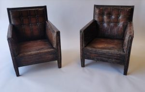 Pair of leather upholstered club chairs