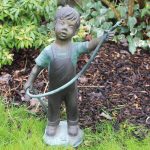 Bronze boy water feature with hose fountain