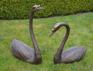 Pair of bronze lifesize models of Swan's